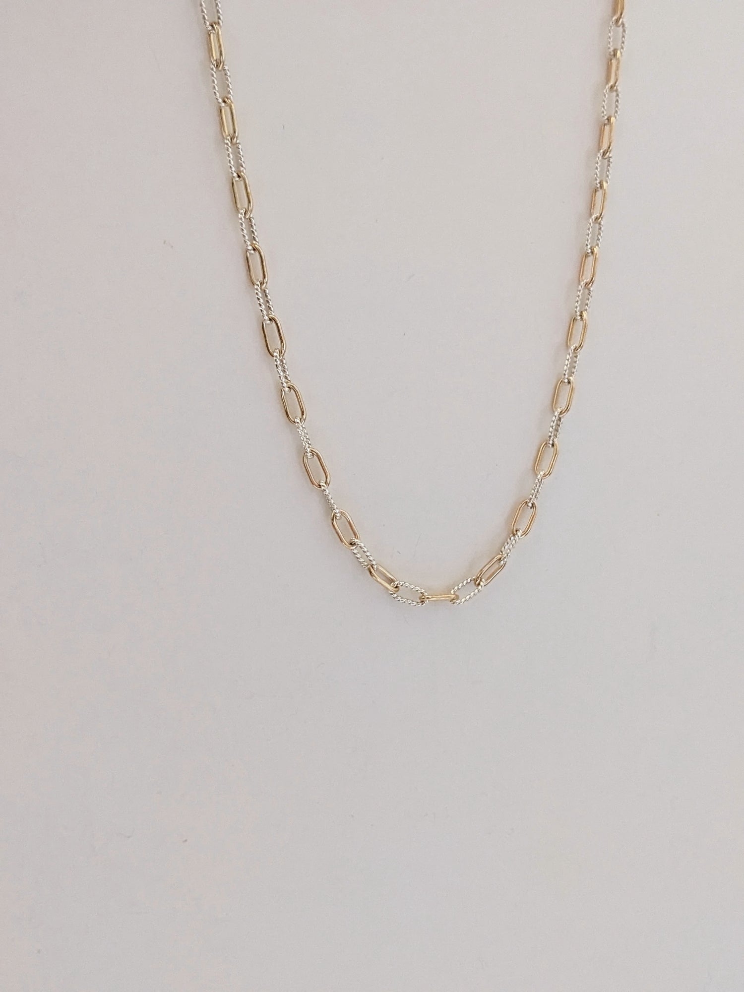 Mixed metal paperclip chain necklace in gold-filled and sterling silver. The versatile two-tone layering chain that goes with everything. Handmade in Brooklyn.