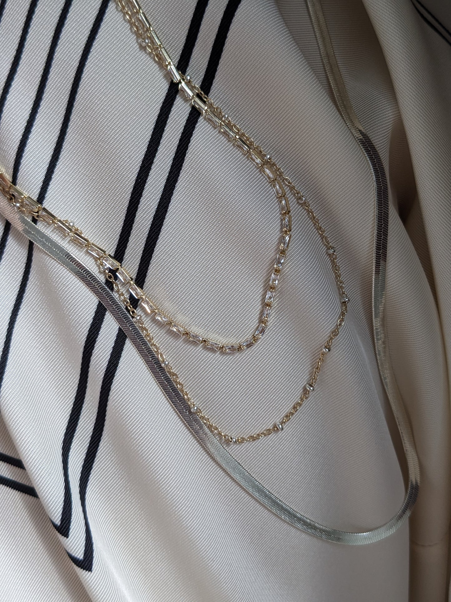 Delicate mixed metal satellite chain necklace in gold-filled and sterling silver. A dainty two-tone layering piece, handmade in Brooklyn by Layer the Love.
