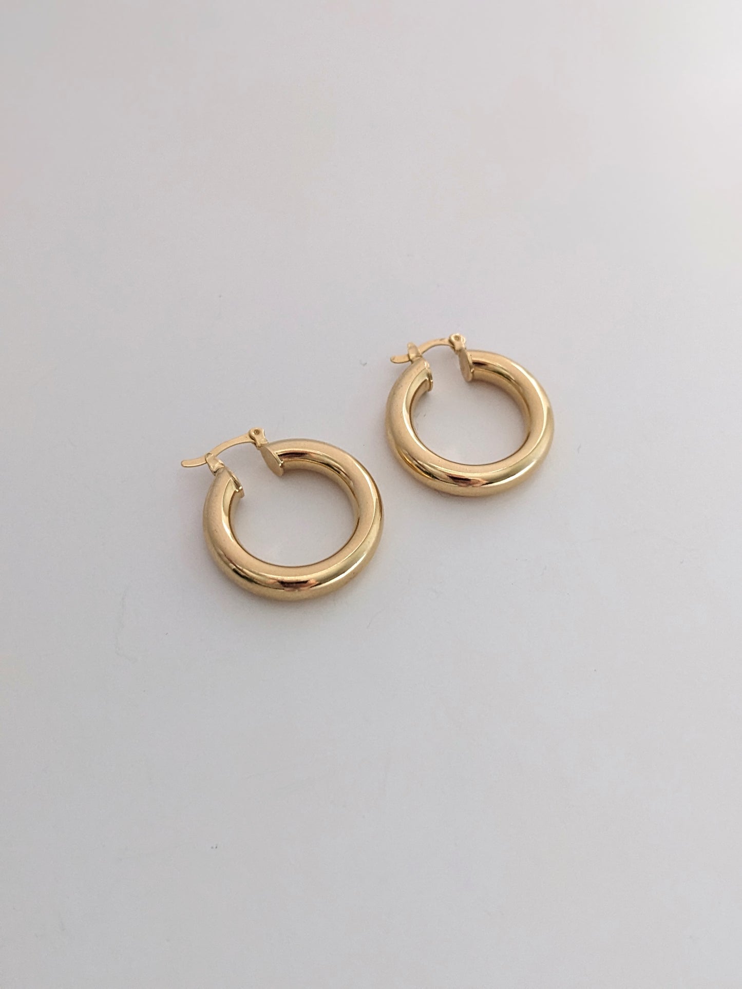 Chunky gold-filled hoop earrings with a bold, high-polish shine. Lightweight, tarnish-resistant, and made for everyday wear. Handmade in Brooklyn.
