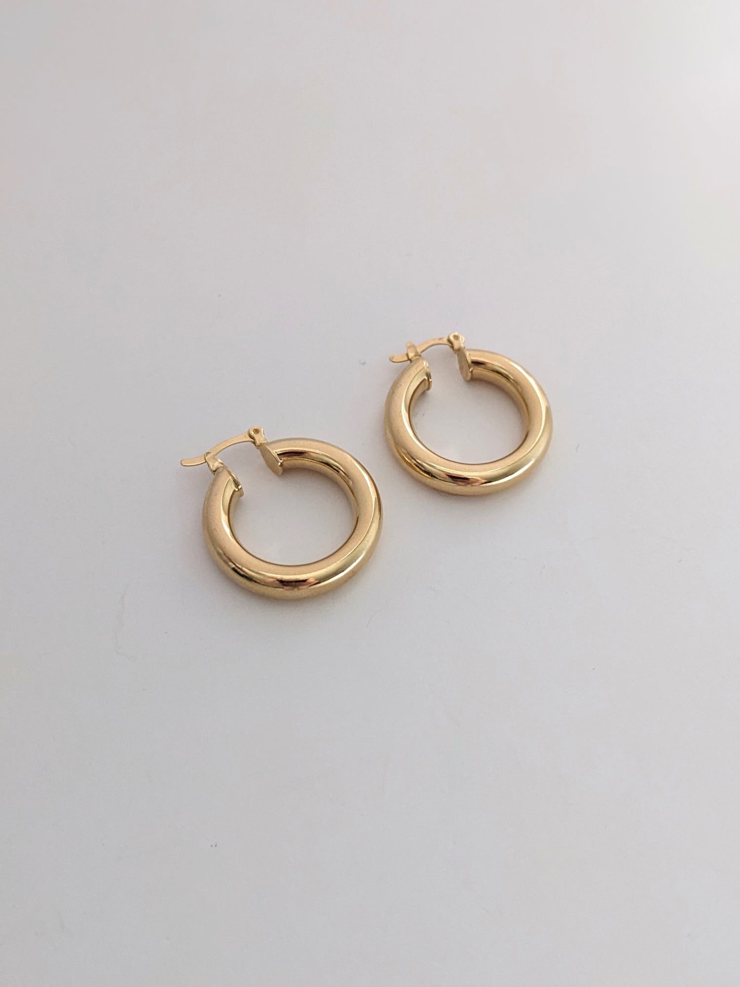 Chunky gold-filled hoop earrings with a bold, high-polish shine. Lightweight, tarnish-resistant, and made for everyday wear. Handmade in Brooklyn.