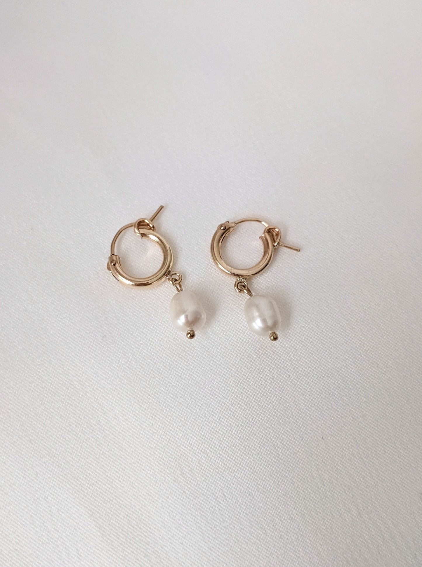 Pearl Huggie Earrings Layer the Love